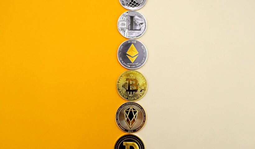 Cryptocurrency lying on white-yellow background