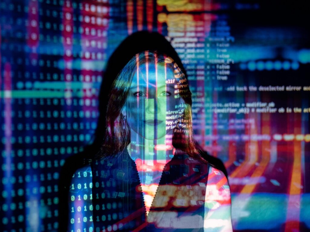 Girl blended into a background full of code